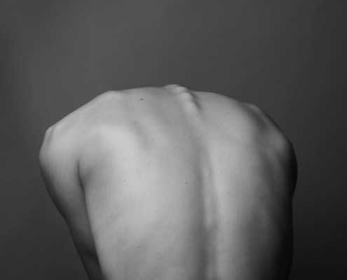 grayscale photo of persons back