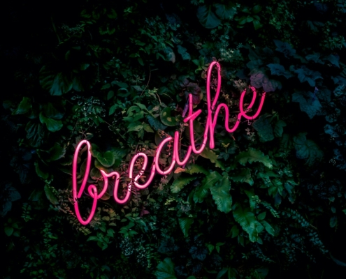 pink breathe neon sign