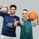 a man and a woman holding a basketball and posing for the camera