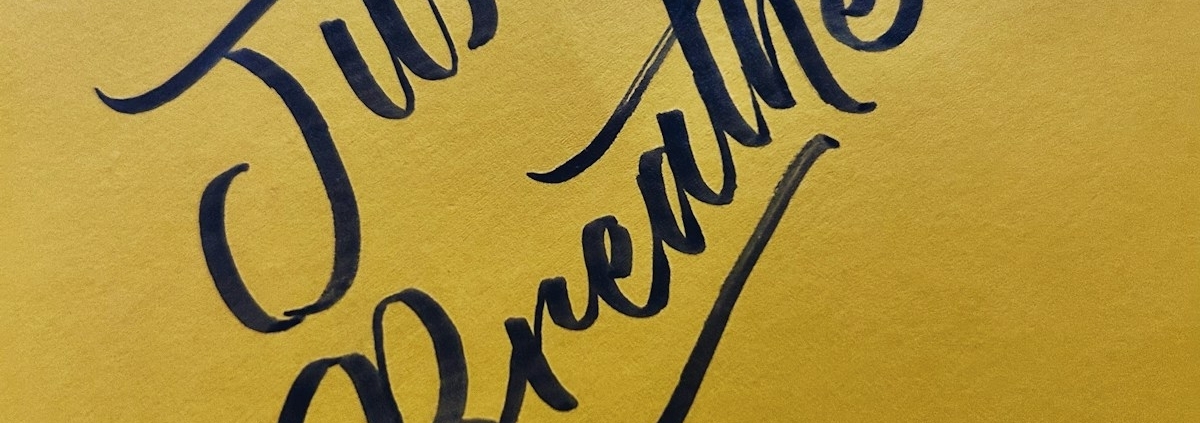 a yellow piece of paper with writing on it