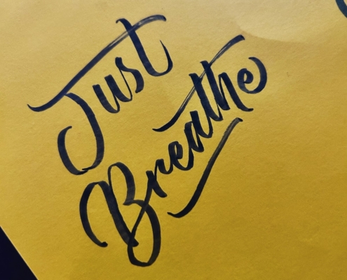 a yellow piece of paper with writing on it